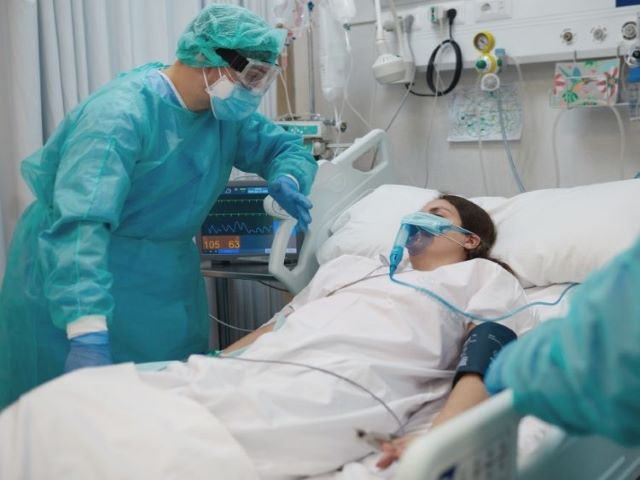 ICU nurse with patient