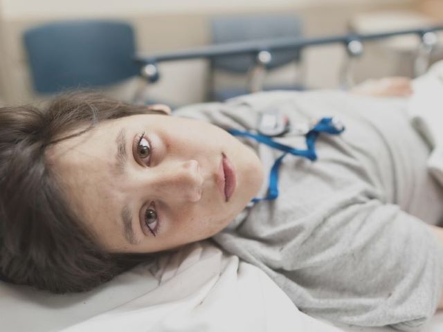 child in hospital bed