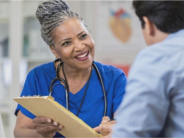 nurse and patient talking