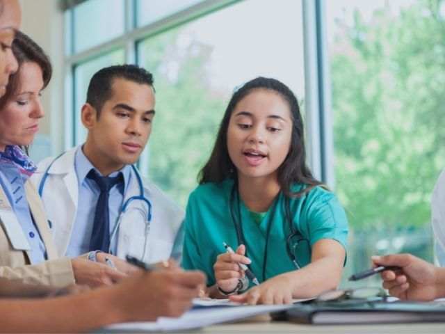 healthcare team holding a debriefing meeting