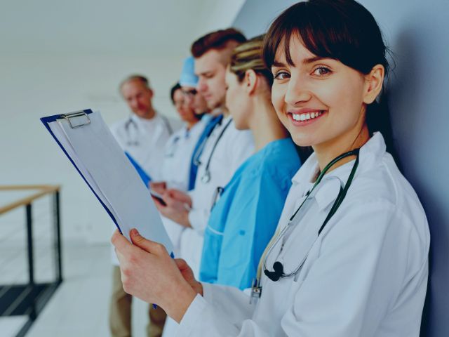 A baby nurse with her staff support team.