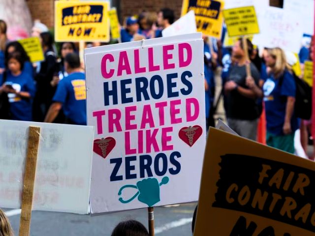 Sign at the nurses strike outside of RWJ university Hospital reading, 