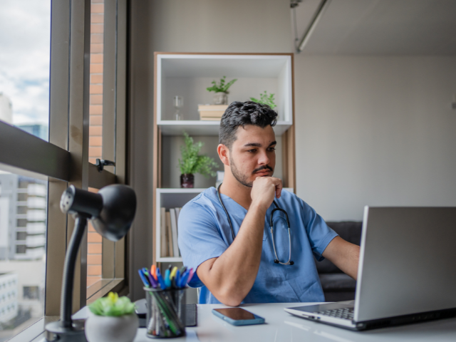 male nurse studying for the washington dc nurse license renewal