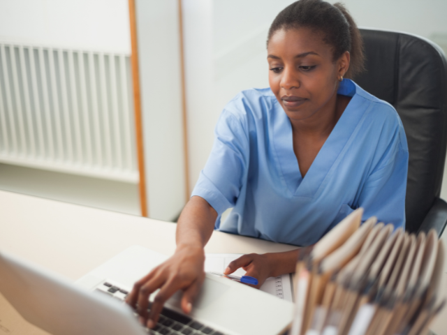 RN taking nursing ceus on her computer at home