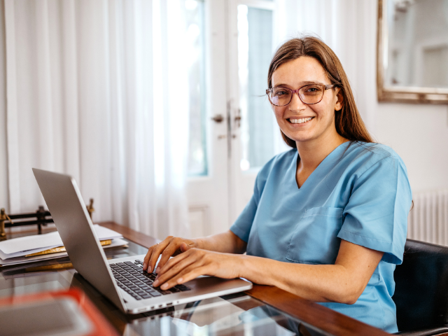 RN completing nursing ceus on her home computer