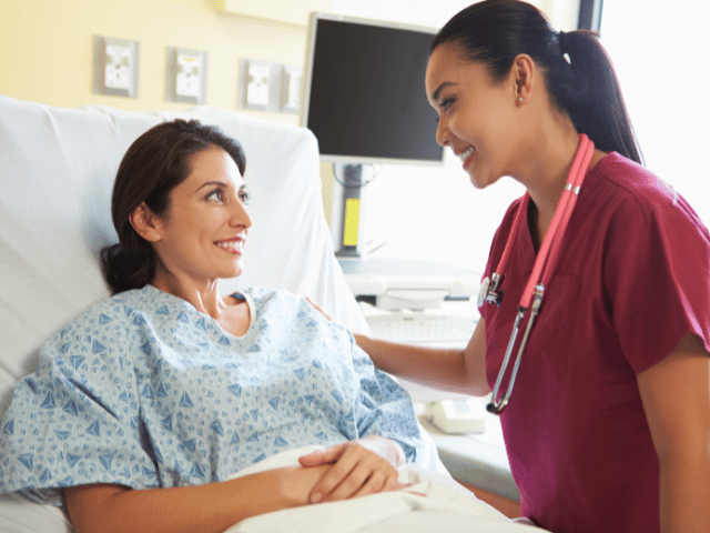 Nurse helping patient at the hospital. 